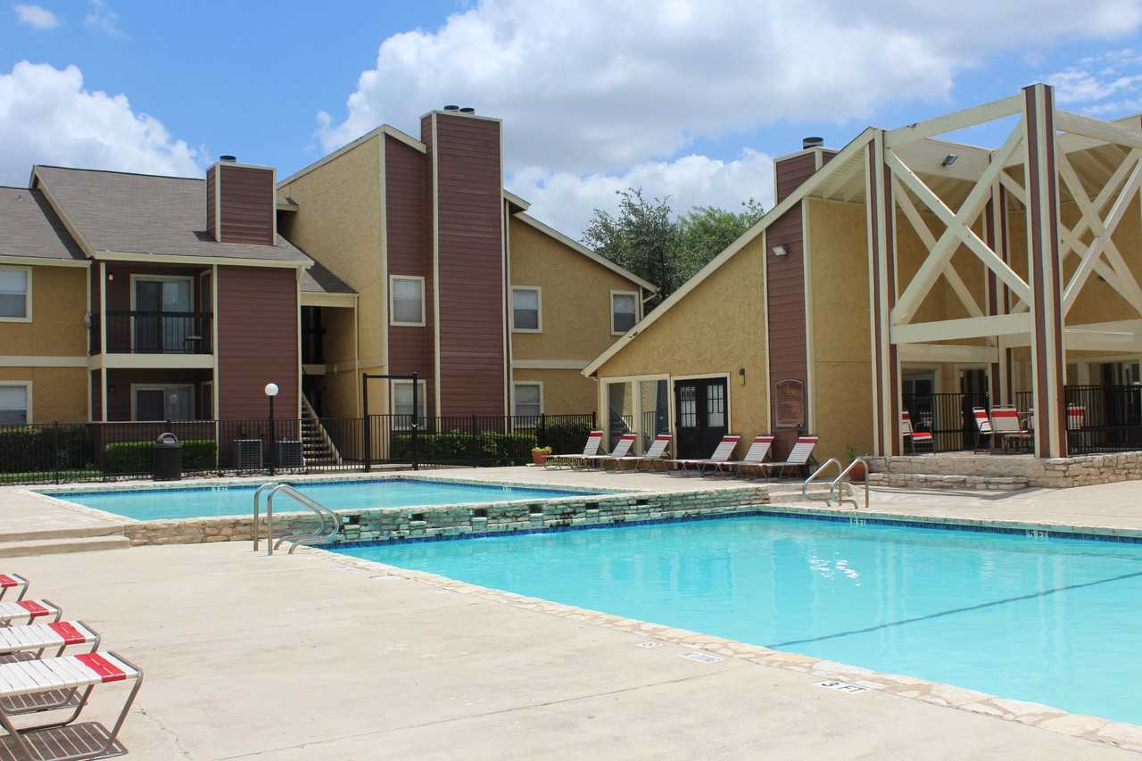 Providence at Domain — The twin pools and the mill-style clubhouse